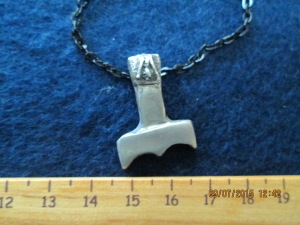 THUNDERER. This silver pendant might represent Thor's hammer. However, it might also represent the hammer of Uku, an Estonian god who carried a hammer. The pendant is based on imagery I saw on a trip to Estonia.